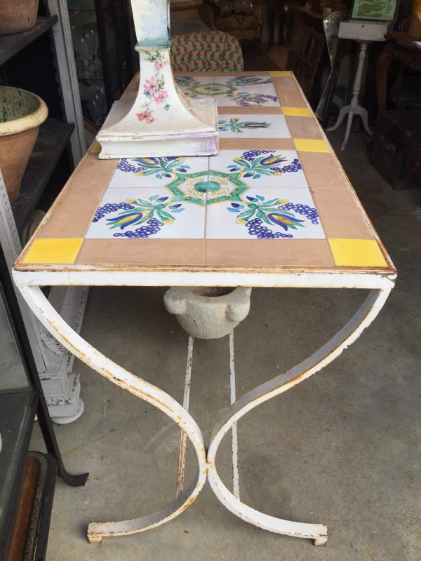 Metal table with tiles on top