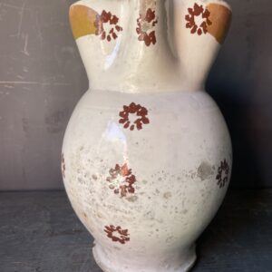 Rustic jug from Puglia decorated with flowers.( circa 1880)