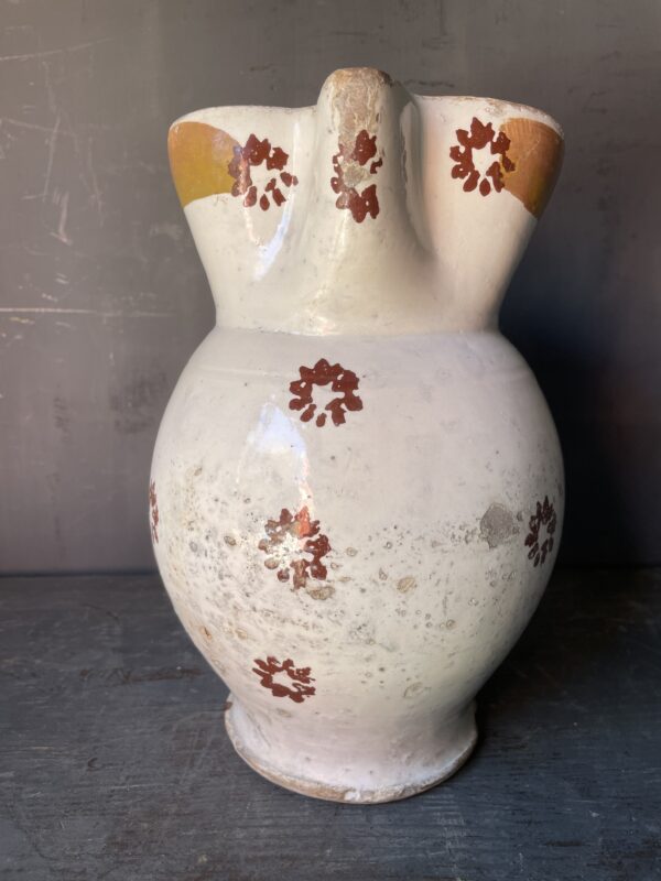 Rustic jug from Puglia decorated with flowers.( circa 1880)