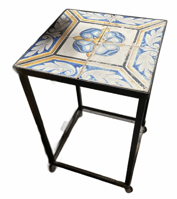 Antique tiles set in a metal table base.(BNP)