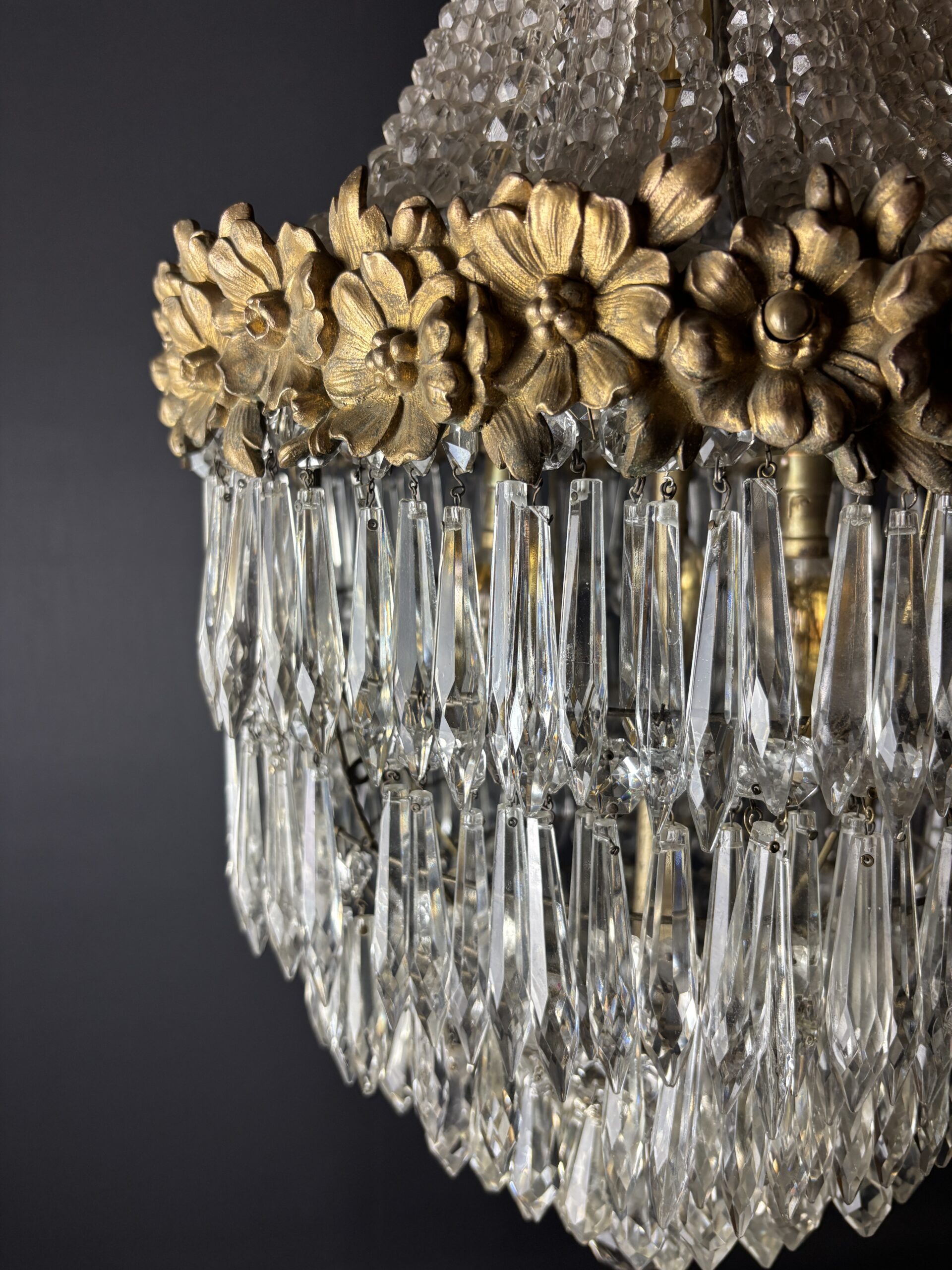 Glamorous chandelier dripping with crystals and crowned with gilded flowers. - Image 6