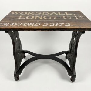 Cast Iron Antique machinists table, with a sign painted top.