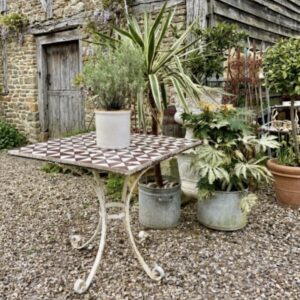 Italian garden table with 100 year old antique Italian majolica tiles.