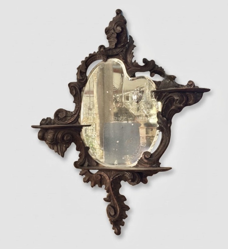 19th century carved wood console with a bevelled glass and cut/drop wheel motif.
